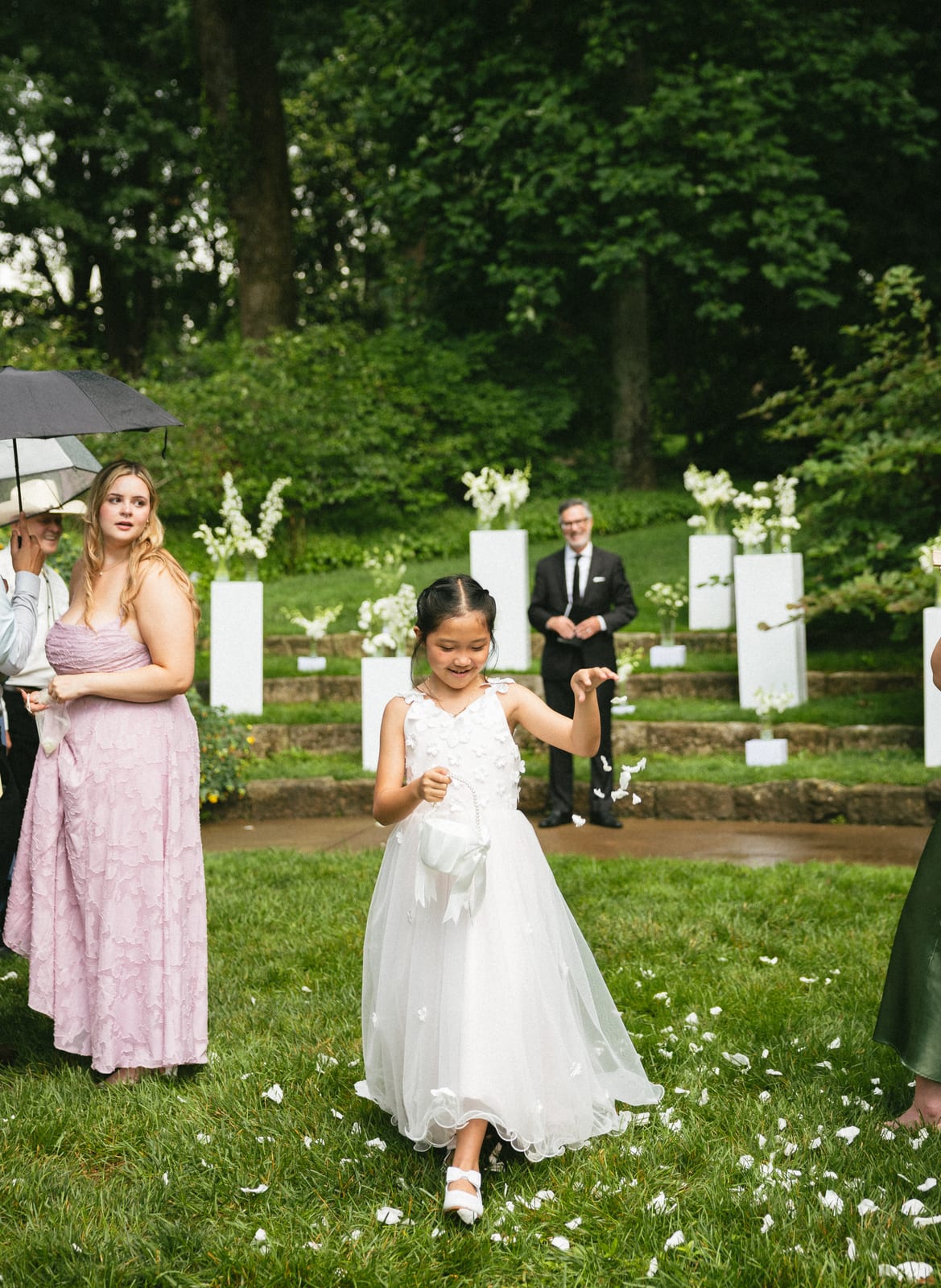 Flower girl scattering petals before the ceremony florals at the Sharon & Matt wedding — designed by Lael Florals