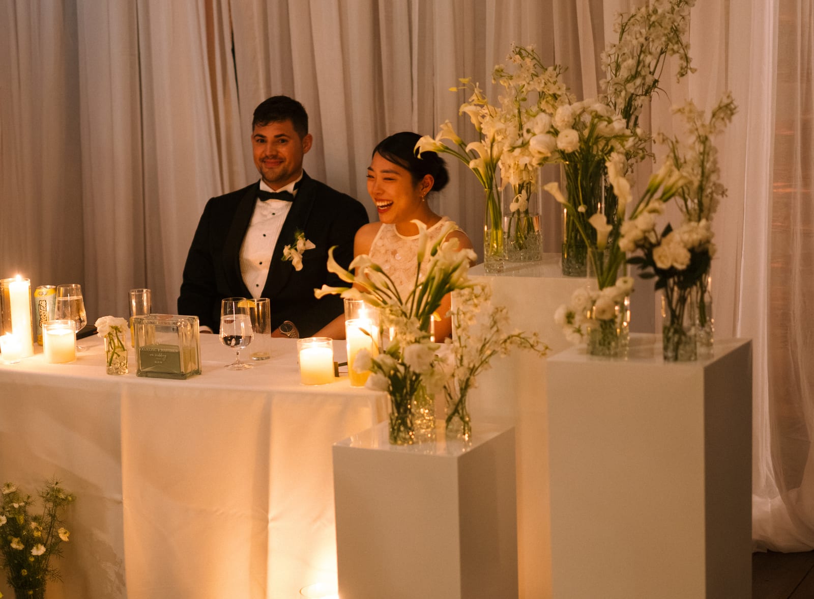 Sweetheart table framed by calla and delphinium arrangements at the Sharon & Matt wedding — designed by Lael Florals