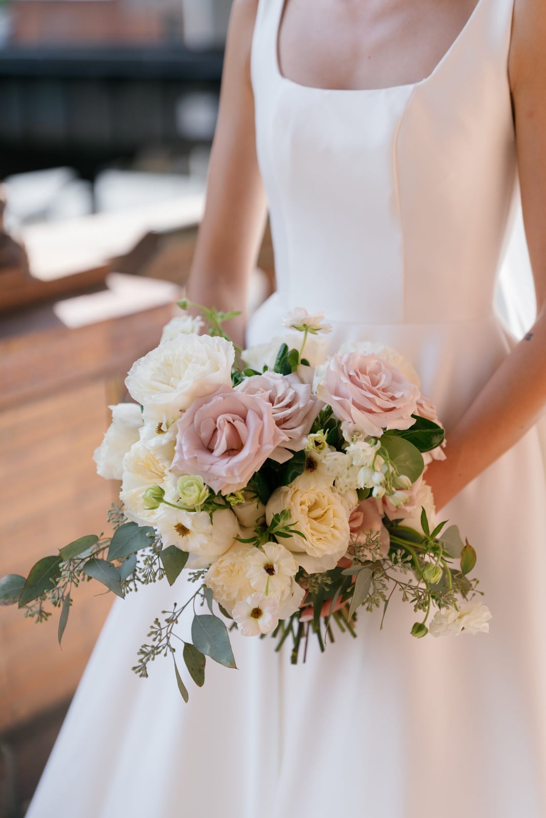 Reception centerpieces at an indoor wedding by Lael Florals